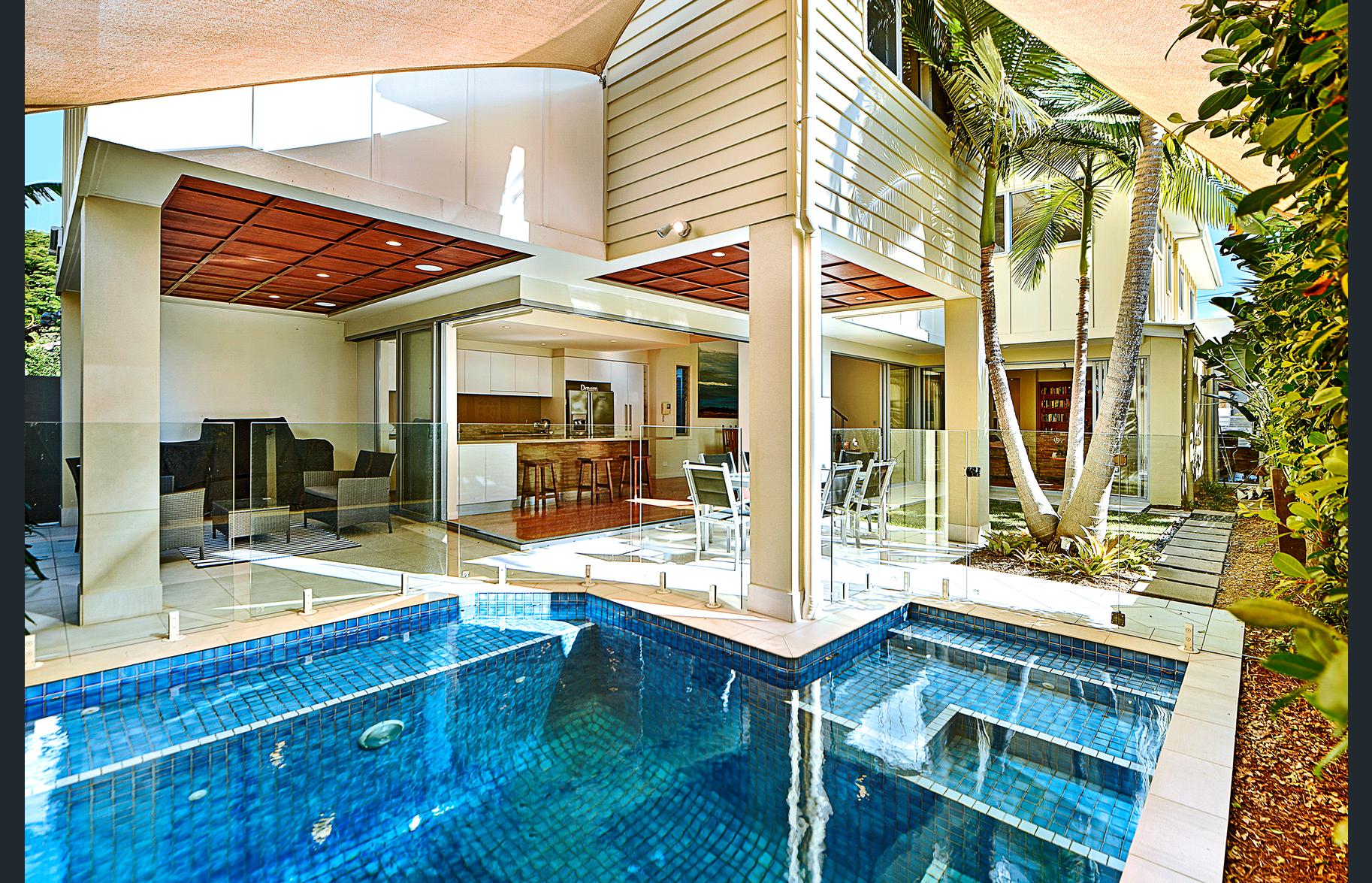 DTK residential project with a pool, open living spaces and tropical landscaping